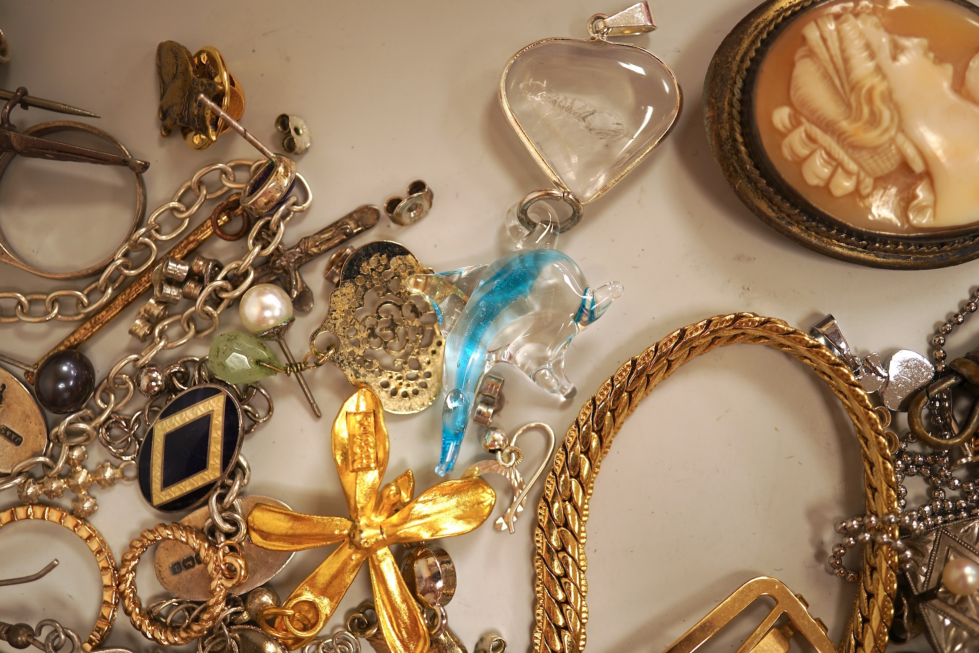 A small collection of assorted costume jewellery and other items including a cut steel shoe buckle, bracelets, chains, pair of silver and enamel oval cufflinks, etc.